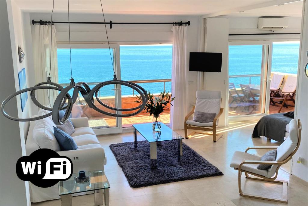 a living room with a view of the ocean at Los Reales 8B in Estepona
