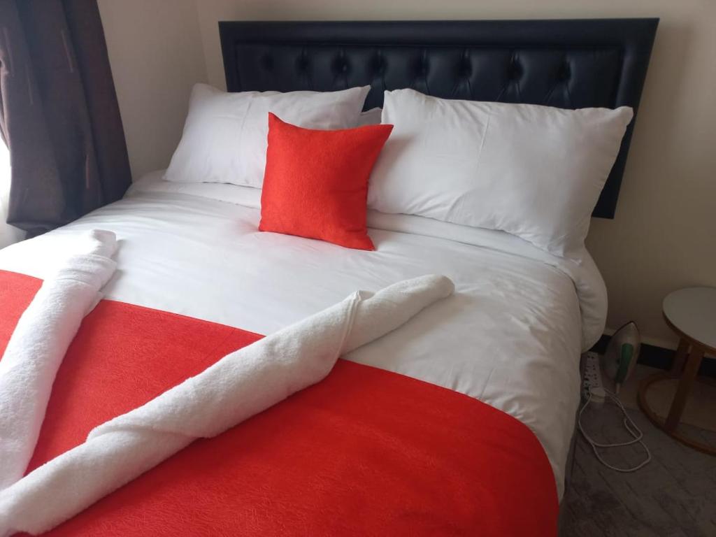 Postel nebo postele na pokoji v ubytování Engra Suites