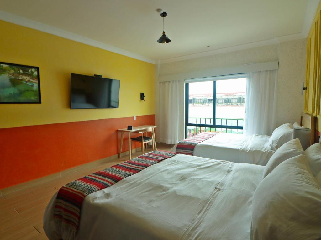 Postel nebo postele na pokoji v ubytování Hotel Boutique Típico