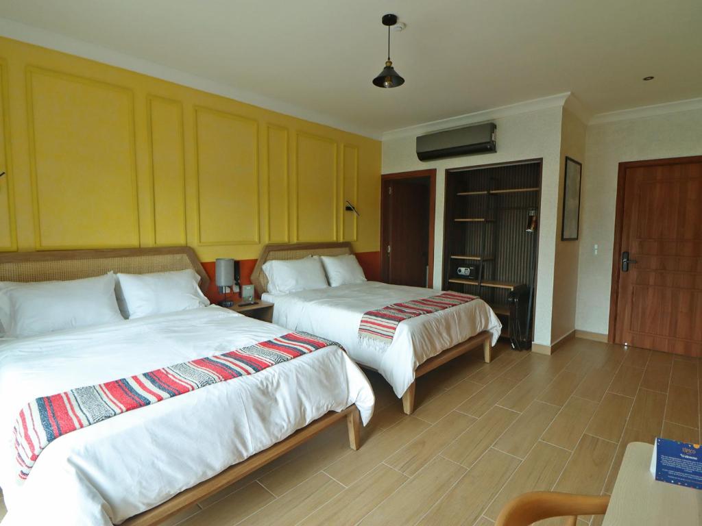 Postel nebo postele na pokoji v ubytování Hotel Boutique Típico
