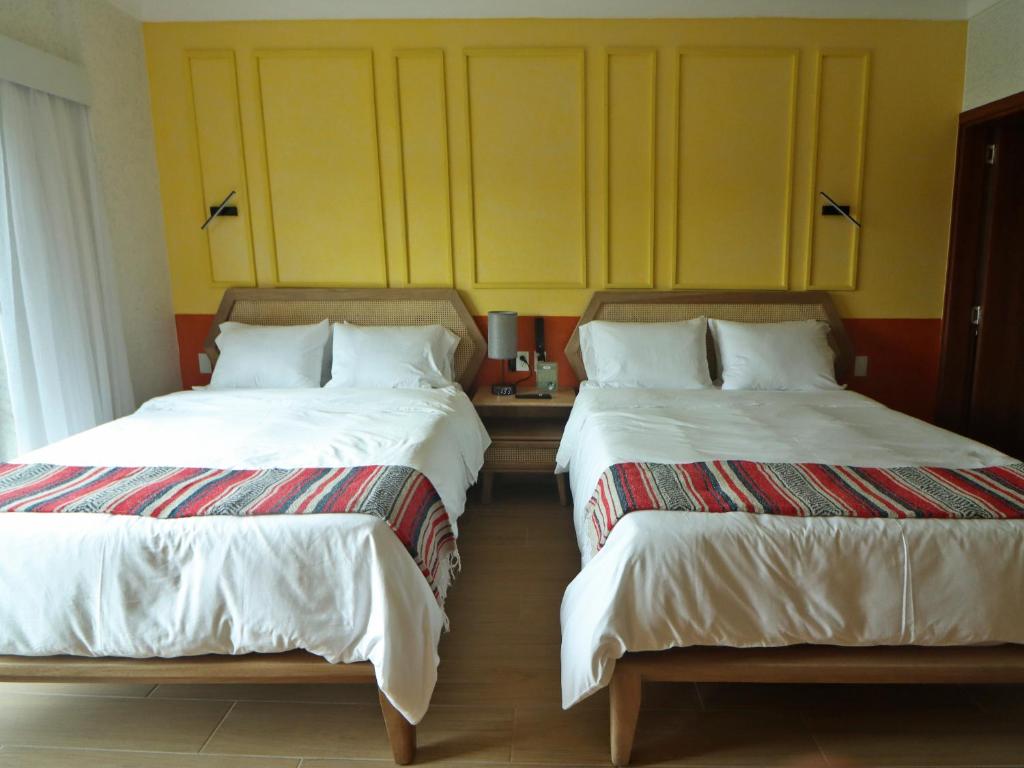 Postel nebo postele na pokoji v ubytování Hotel Boutique Típico
