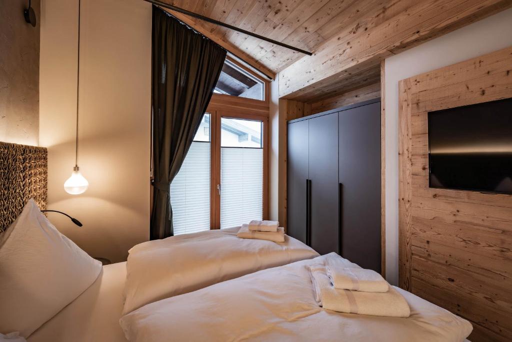 Posteľ alebo postele v izbe v ubytovaní Loft in the Alps Penthouse