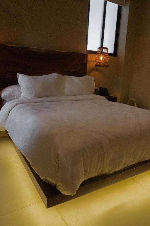 Postel nebo postele na pokoji v ubytování Hotel Scappata