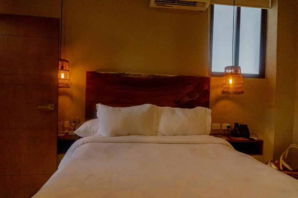 Postel nebo postele na pokoji v ubytování Hotel Scappata