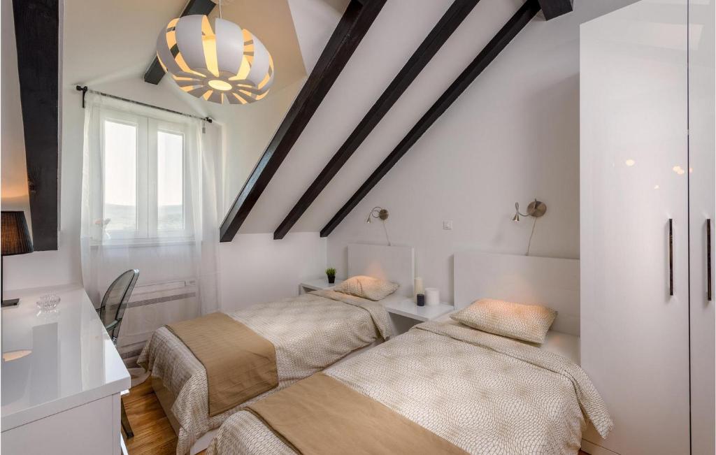 Postel nebo postele na pokoji v ubytování Villa Eterna