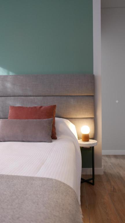 Postel nebo postele na pokoji v ubytování Huli B&B
