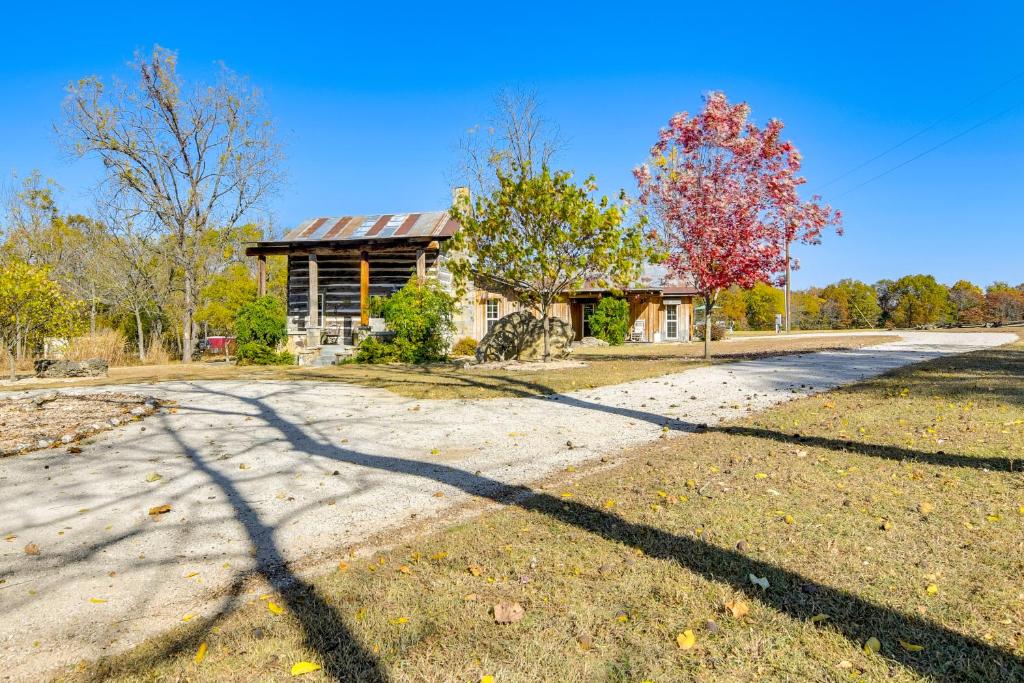 an empty road in front of a house at half-Mi to Lake Cabin on 43 Acres in Shell Knob! in Shell Knob