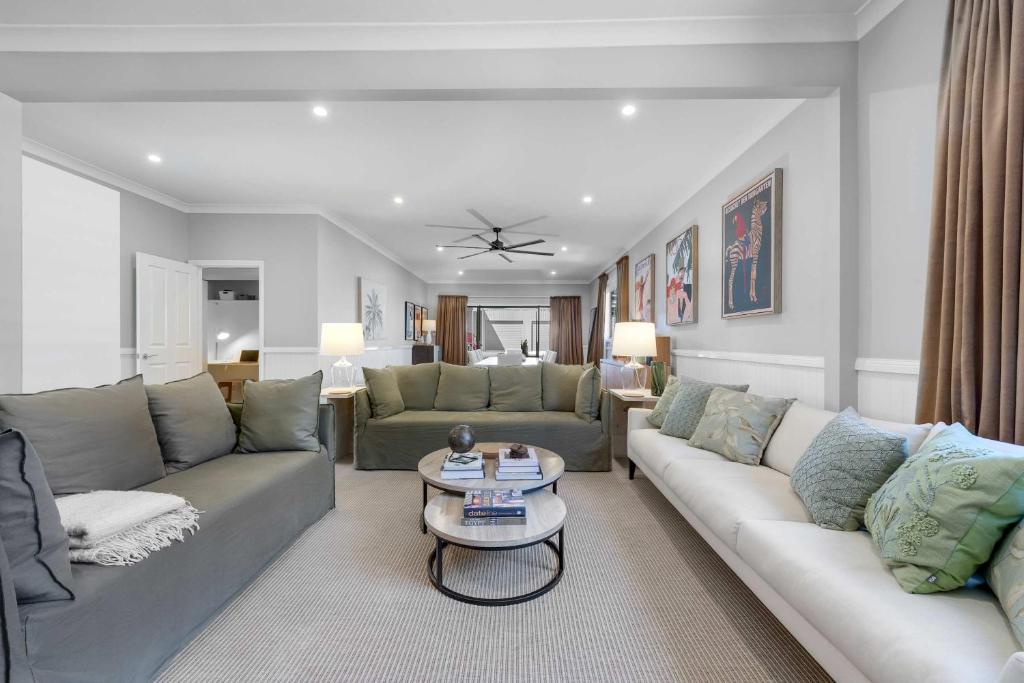 a living room with a couch and a table at Dalton Cottage - Charm & Convenience in Orange