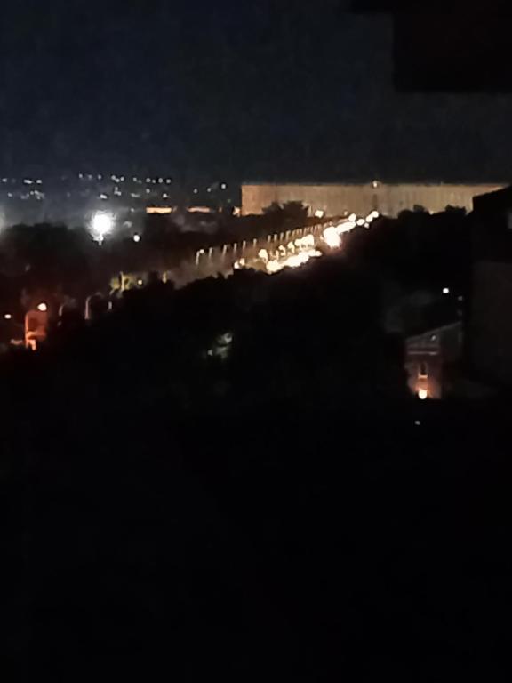 a view of a city at night with lights at Luna Reale Relais e Suite in San Nicola La Strada