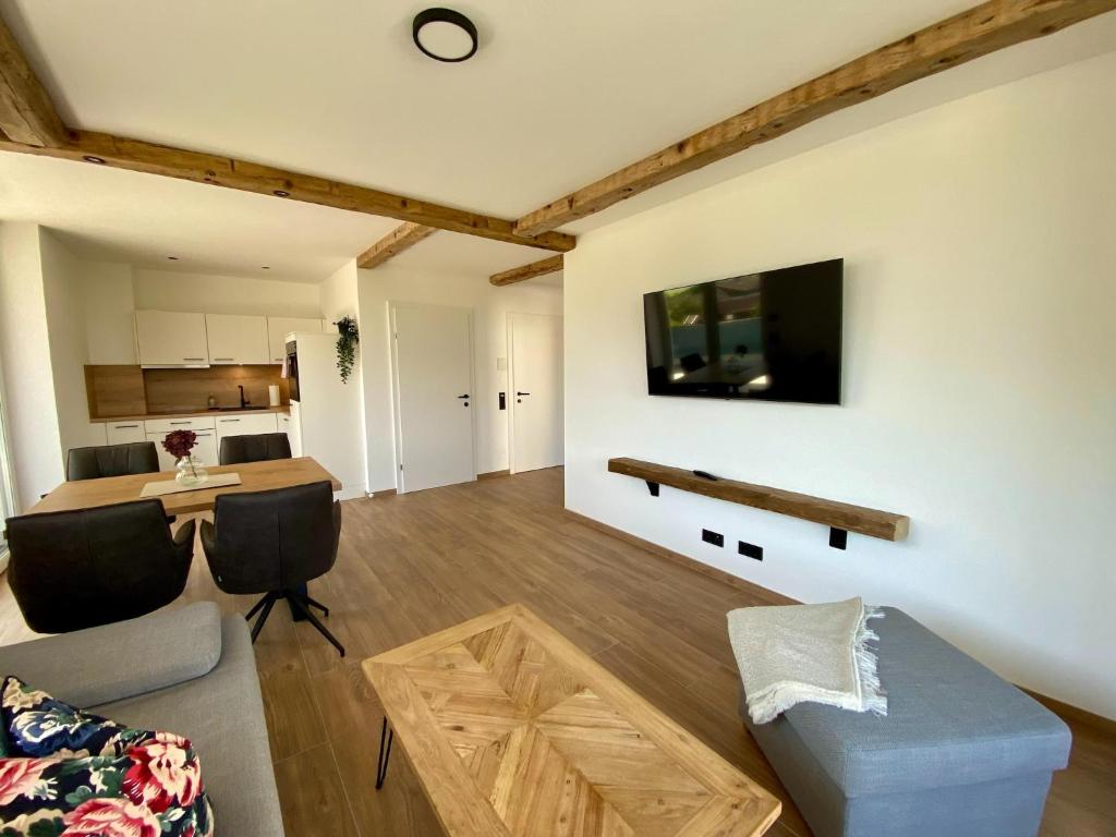 Televízia a/alebo spoločenská miestnosť v ubytovaní Apartment in Saalfelden near Ski Slopes