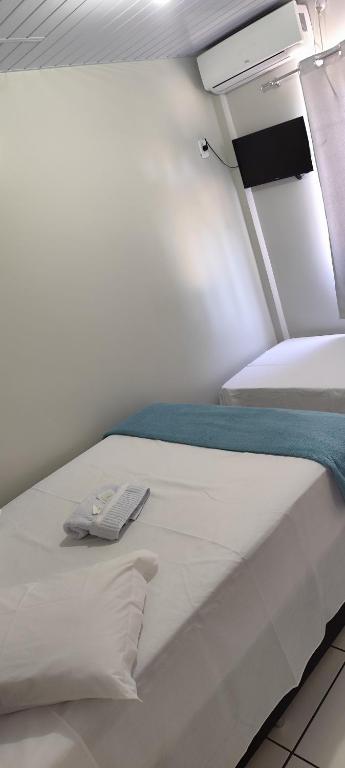 Postel nebo postele na pokoji v ubytování Hotel Andorinha