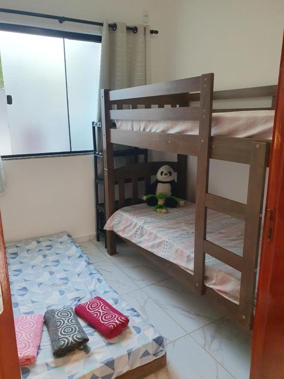 Postel nebo postele na pokoji v ubytování Quarto & Conforto