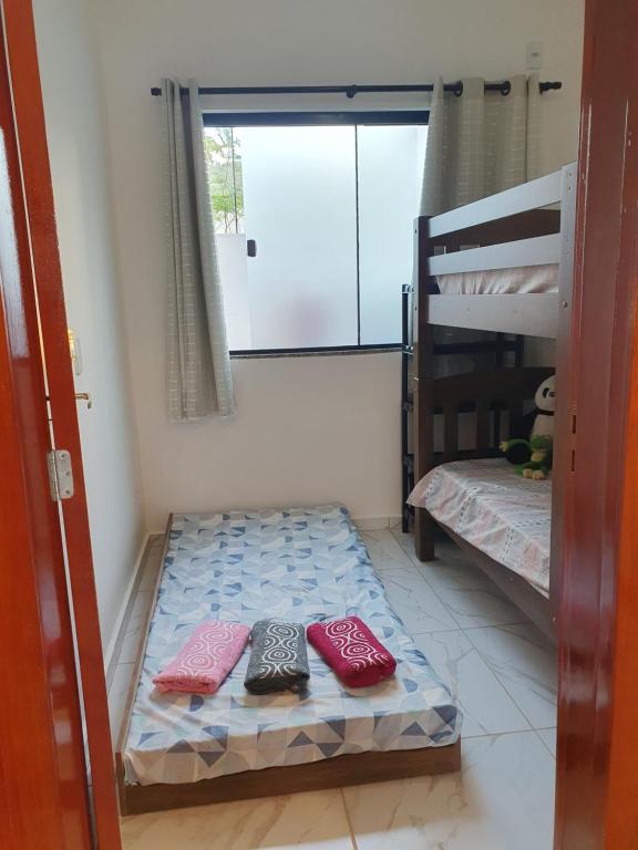 Postel nebo postele na pokoji v ubytování Quarto & Conforto