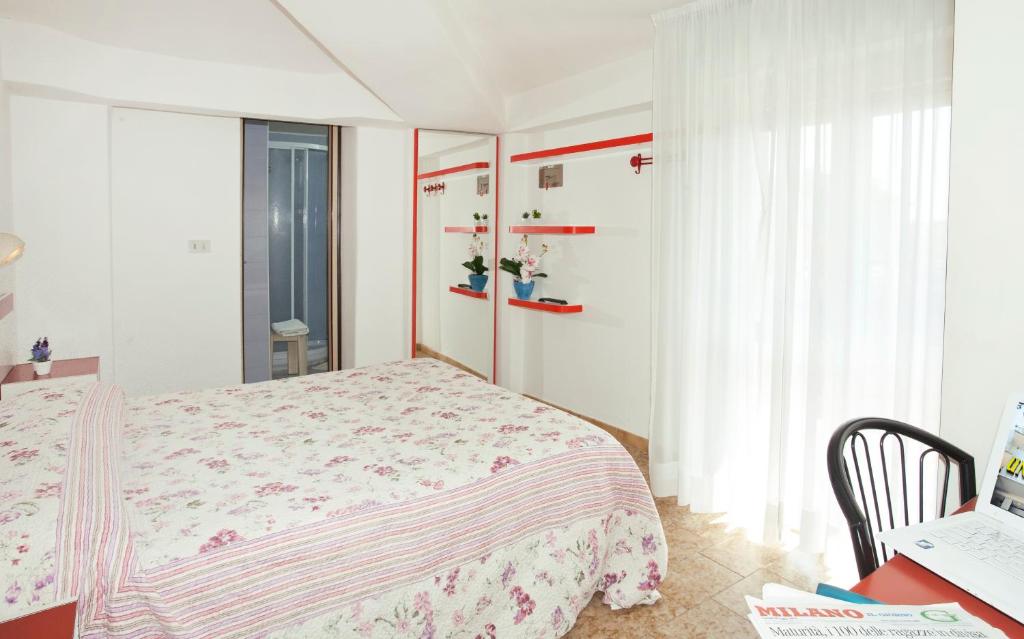 Postel nebo postele na pokoji v ubytování Hotel Universal