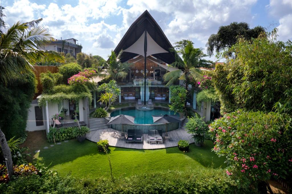 an aerial view of a house with a swimming pool at Villa Toraja A Hidden Luxury Retreat in the canggu in Canggu