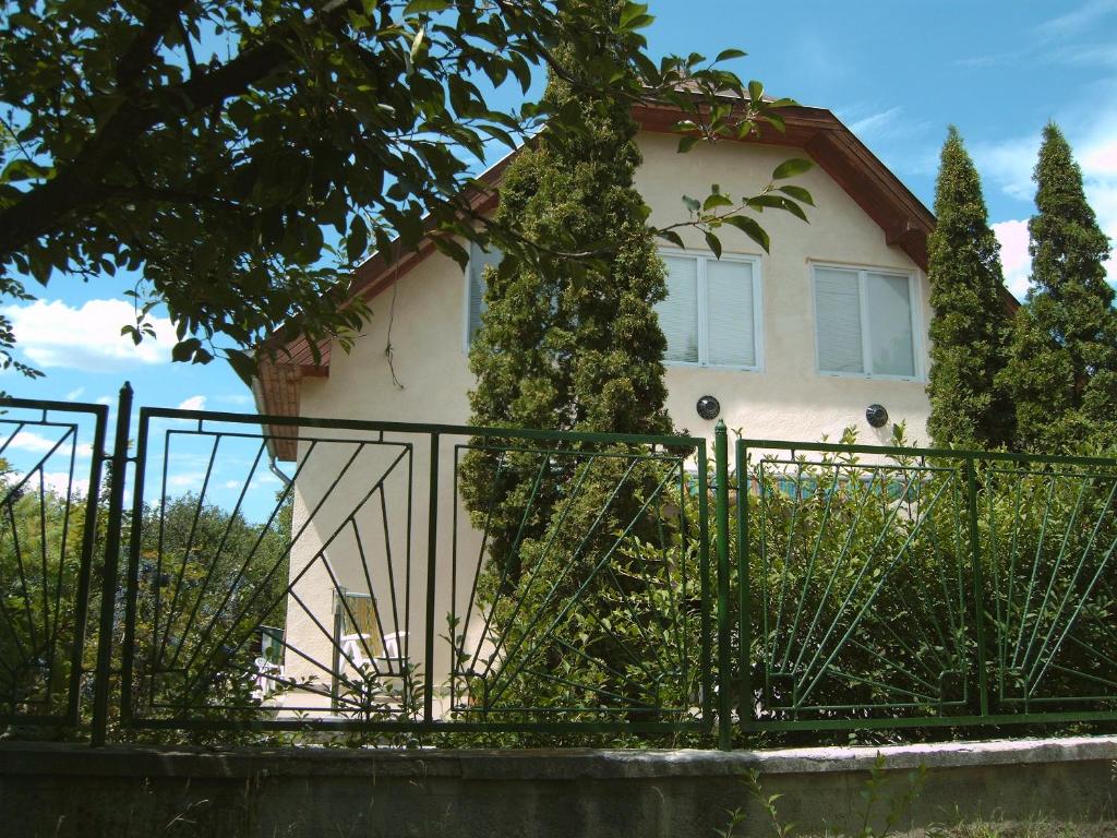 a house with a gate in front of it at Anita Haus in Gárdony