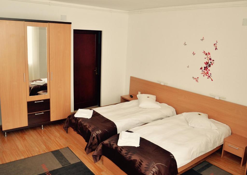 Postel nebo postele na pokoji v ubytování ApartHotel Zorilor