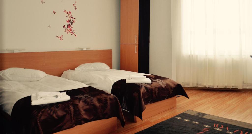 Postel nebo postele na pokoji v ubytování ApartHotel Zorilor