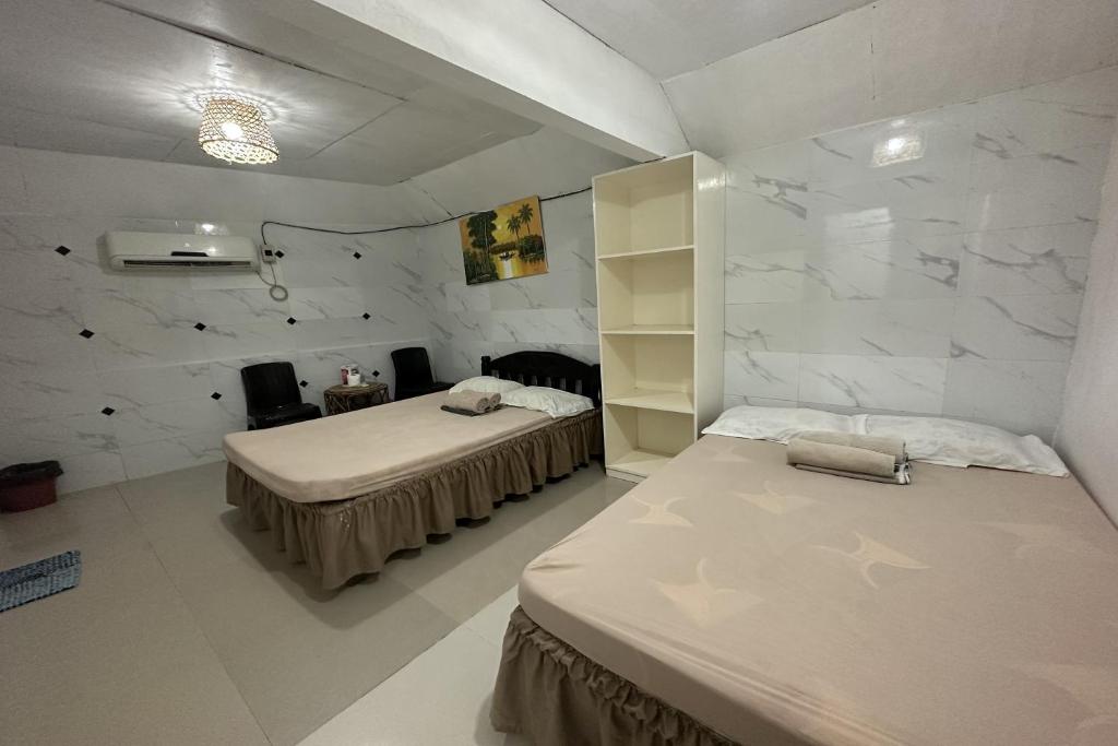 Postel nebo postele na pokoji v ubytování Monaliza Surf Resort La Union