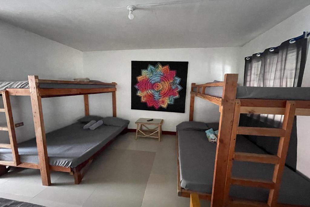 Postel nebo postele na pokoji v ubytování Monaliza Surf Resort La Union