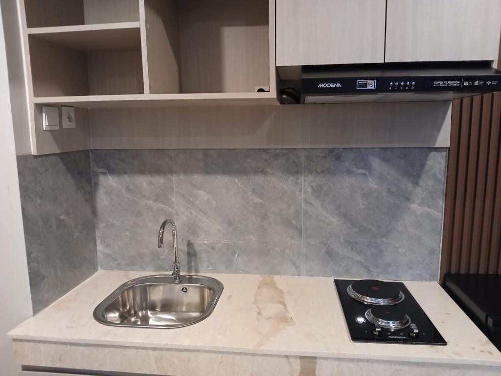 Kuchyň nebo kuchyňský kout v ubytování Nemuru Grand Suites