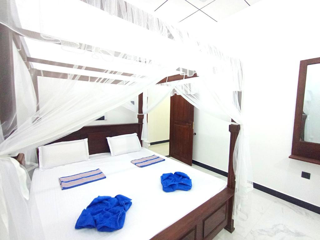 Postel nebo postele na pokoji v ubytování Amal Guest house