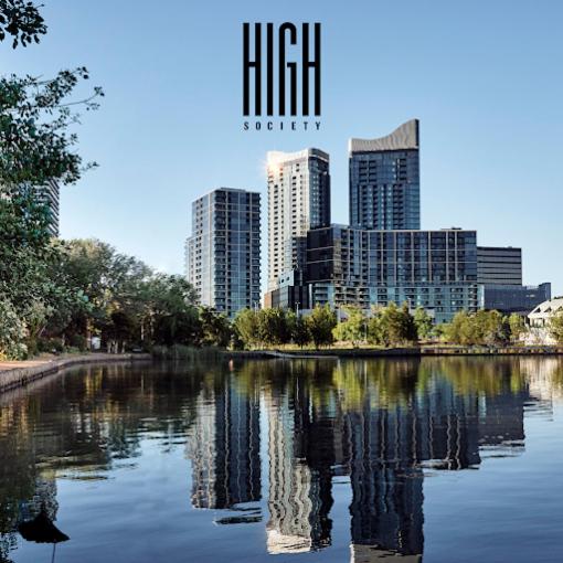 a city skyline with skyscrapers and a body of water at Lakeside Luxe, Free parking, AIS, Spa, Gym, Sauna and Pool in Belconnen