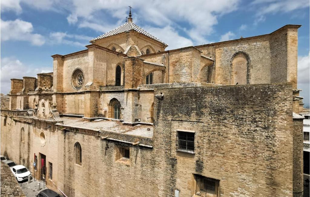 un viejo edificio con una iglesia encima en Amazing Apartment In Carmona With Wifi, en Carmona