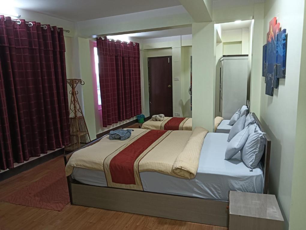 Postel nebo postele na pokoji v ubytování Hotel Pristine
