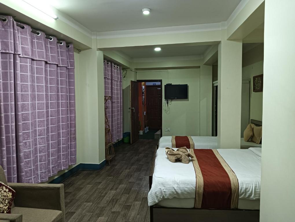 Postel nebo postele na pokoji v ubytování Hotel Pristine