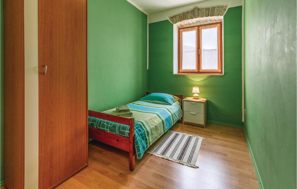 Łóżko lub łóżka w pokoju w obiekcie 2 Bedroom Stunning Apartment In Fazana