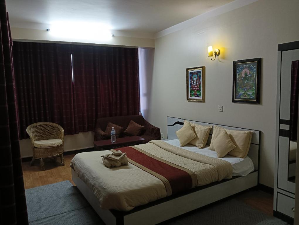 Postel nebo postele na pokoji v ubytování Hotel Pristine