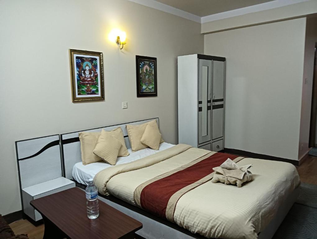 Postel nebo postele na pokoji v ubytování Hotel Pristine
