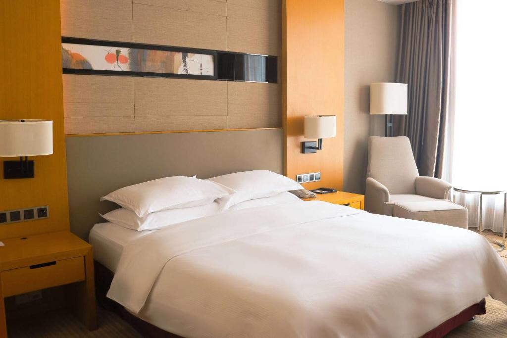 Postel nebo postele na pokoji v ubytování Wyndham Shanghai Nanxiang
