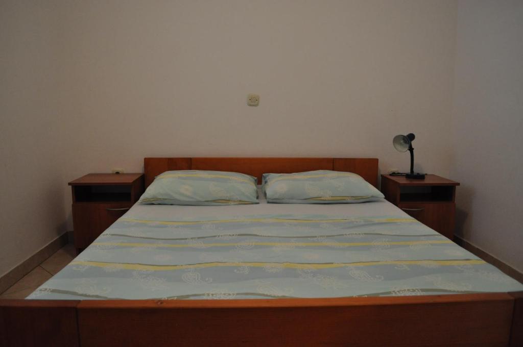 Posteľ alebo postele v izbe v ubytovaní Apartments Petar Maksan