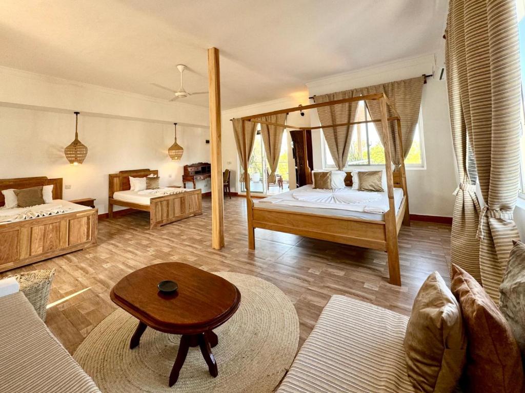 Postel nebo postele na pokoji v ubytování Shirley Residence Kiwengwa