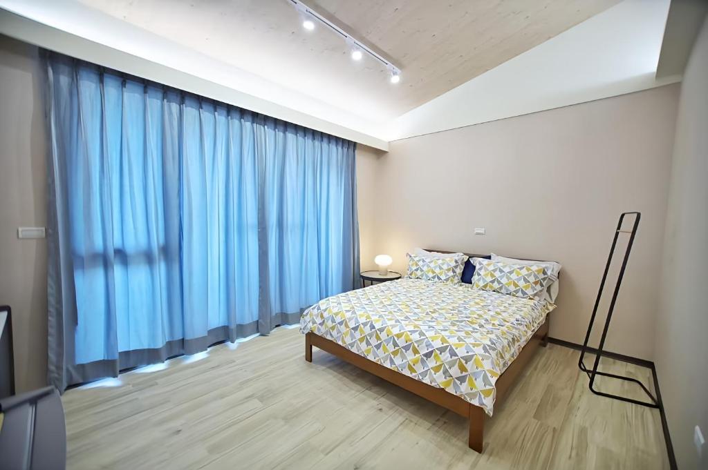 Postel nebo postele na pokoji v ubytování 新興九洲會館- Kyushu Homestay