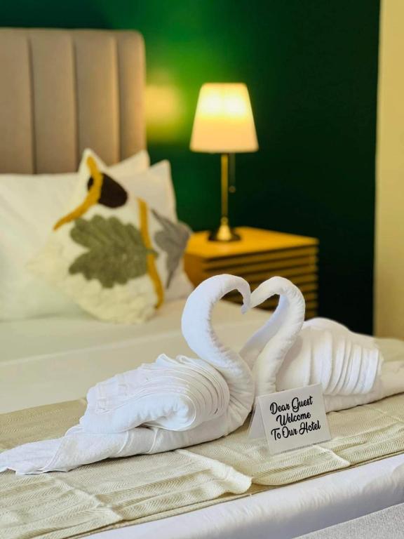 Postel nebo postele na pokoji v ubytování Tambisan Resort