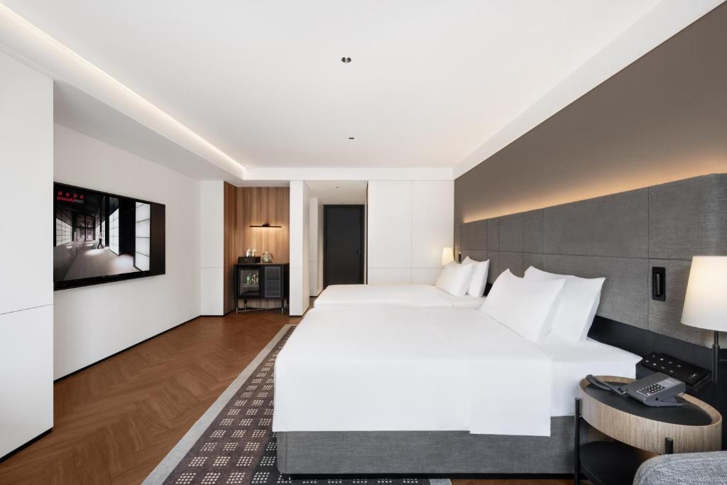 Postel nebo postele na pokoji v ubytování Intercity Hotel Chengdu High-tech Global Center