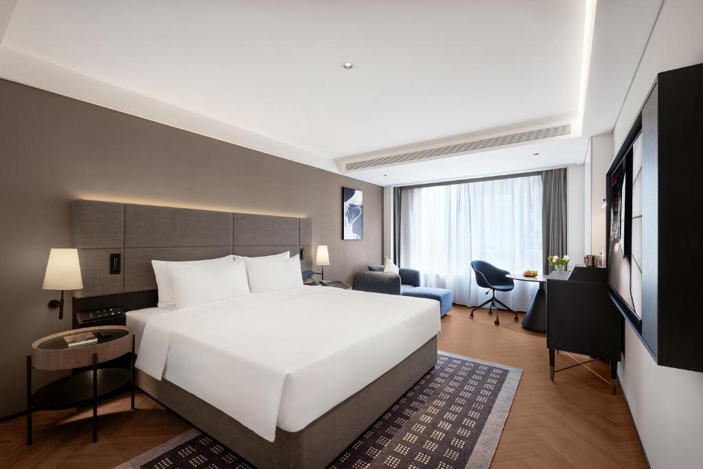 Postel nebo postele na pokoji v ubytování Intercity Hotel Chengdu High-tech Global Center