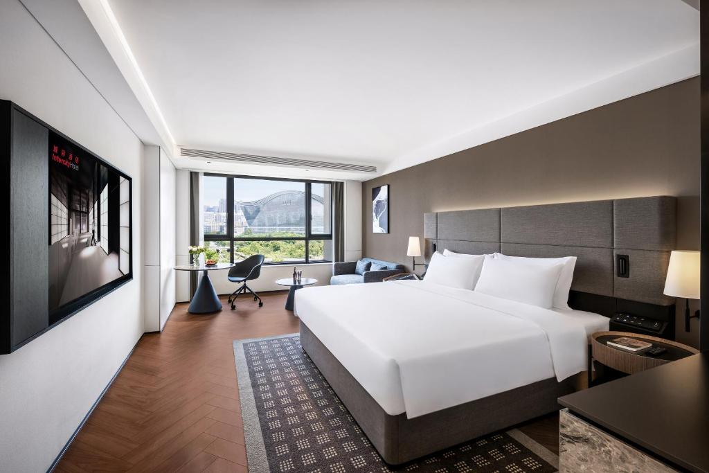 Postel nebo postele na pokoji v ubytování Intercity Hotel Chengdu High-tech Global Center