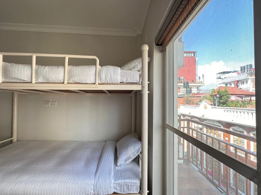 Postel nebo postele na pokoji v ubytování Hotel Sohum