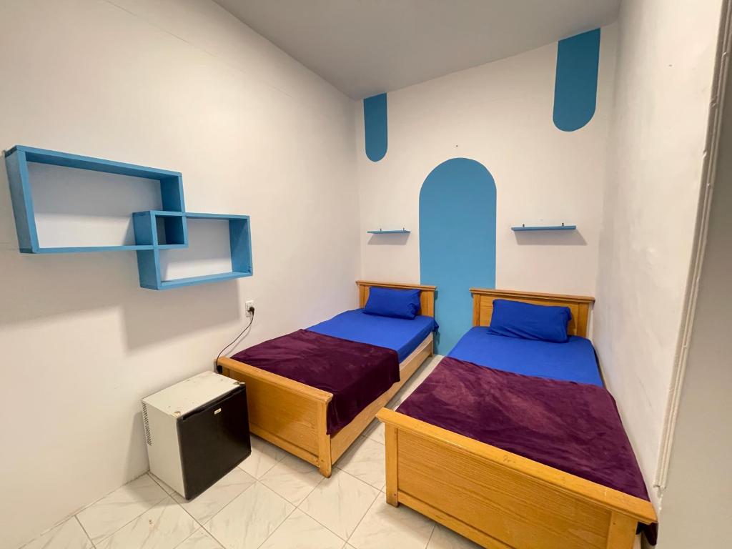 Postel nebo postele na pokoji v ubytování whales camp dahab