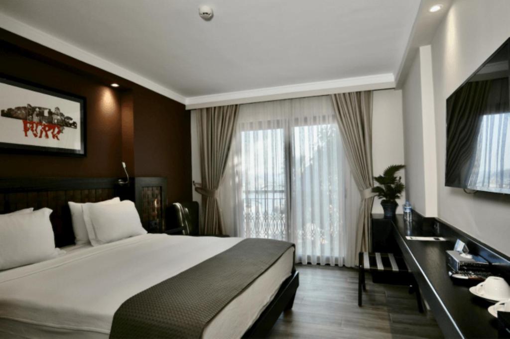 Postel nebo postele na pokoji v ubytování Resa Hotel Göcek
