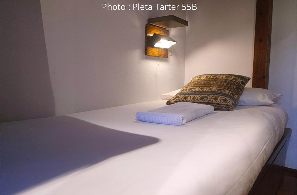 Postel nebo postele na pokoji v ubytování AC Apartaments Tarter Chalet