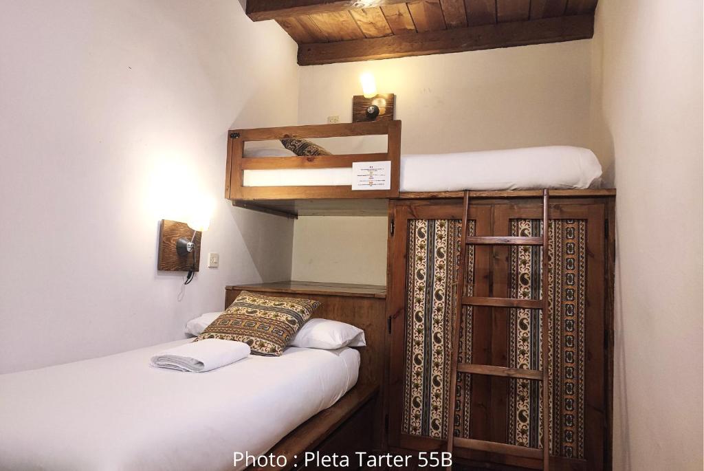 Postel nebo postele na pokoji v ubytování AC Apartaments Tarter Chalet