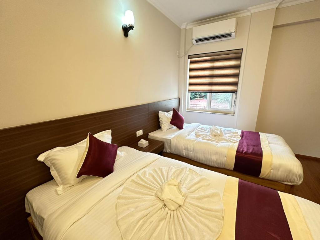 Postel nebo postele na pokoji v ubytování Hotel Sohum