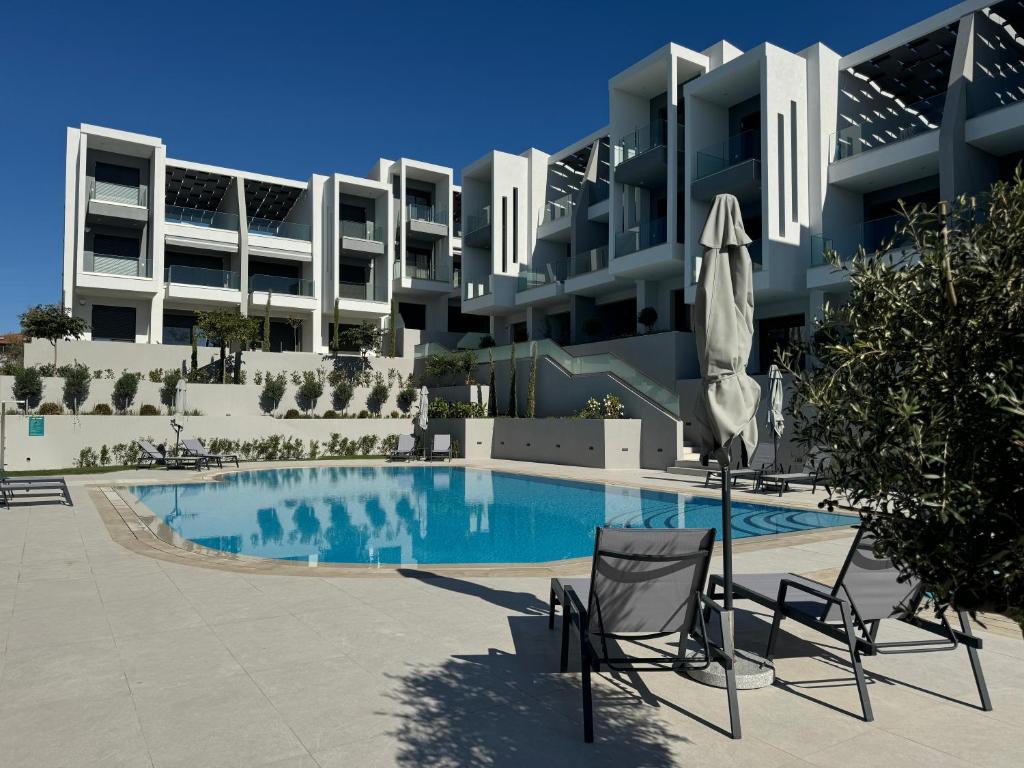 Swimmingpoolen hos eller tæt på Artion Cozy Residence Nikiti