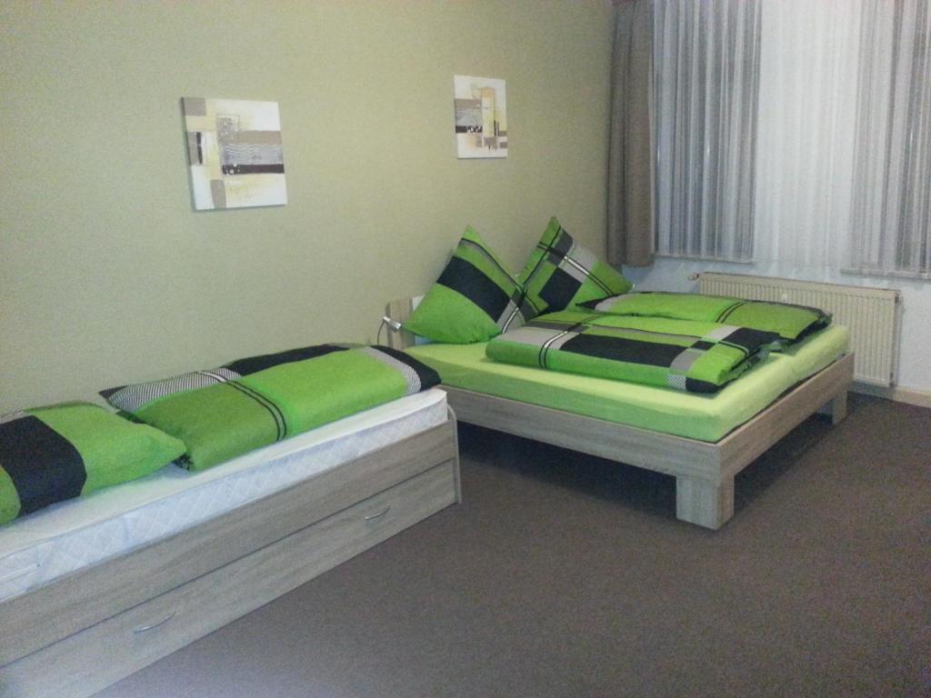 En eller flere senge i et værelse på Ferienwohnung am Markt
