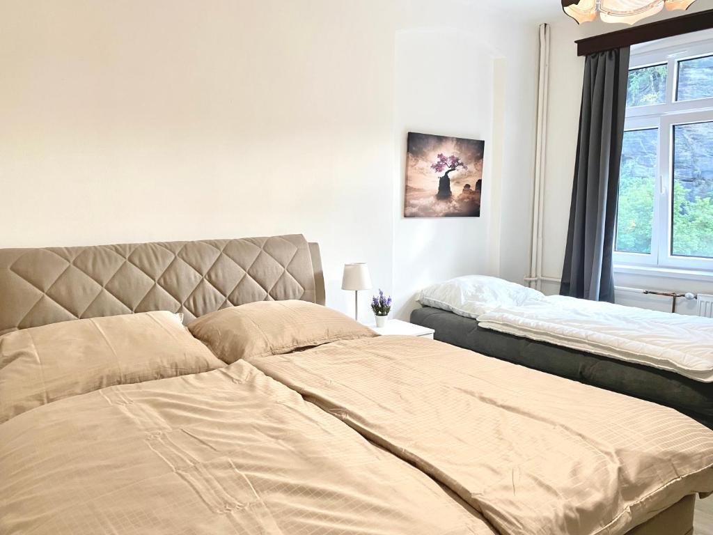 Postel nebo postele na pokoji v ubytování Hotel Labe